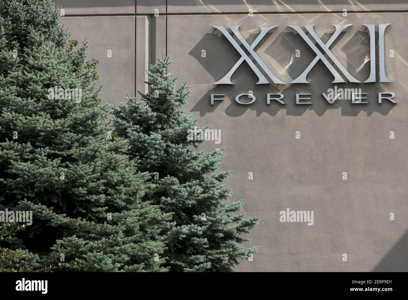A logo sign outside of a Forever 21 (XXI Forever) retail store in