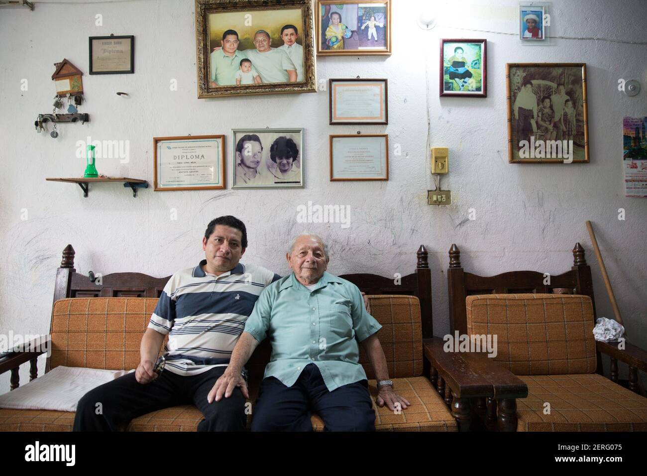 Portrait of Tomás Garma Rodriguez (R), 87, a retired Pemex worker and his son Tomás Garma Mejia (L), 45 at their home in Villahermosa, Tabasco state, Mexico on June 18, 2018. (Photo by Bénédicte Desrus/Sipa USA) Stock Photo