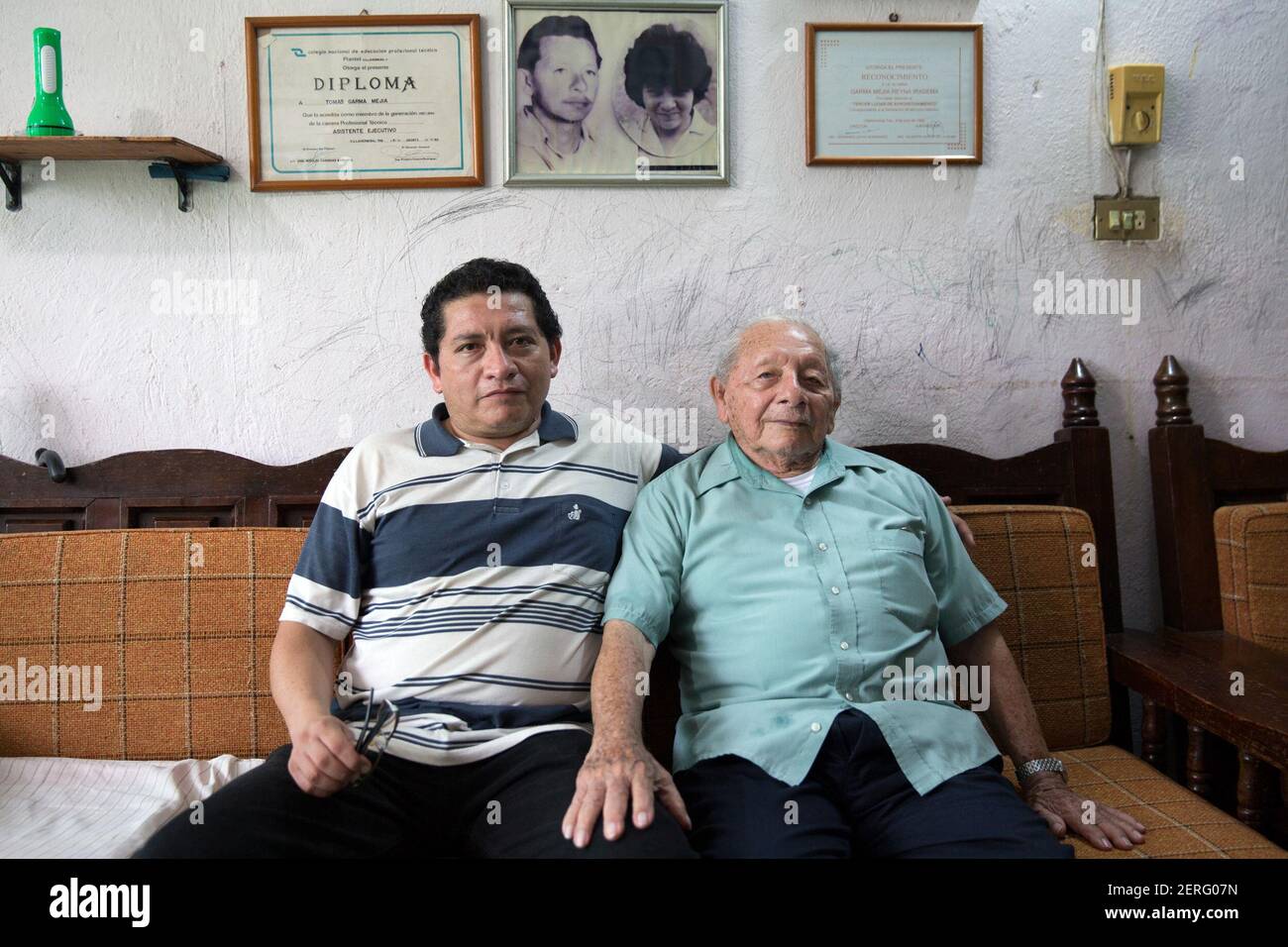Portrait of Tomás Garma Rodriguez (R), 87, a retired Pemex worker and his son Tomás Garma Mejia (L), 45 at their home in Villahermosa, Tabasco state, Mexico on June 18, 2018. (Photo by Bénédicte Desrus/Sipa USA) Stock Photo