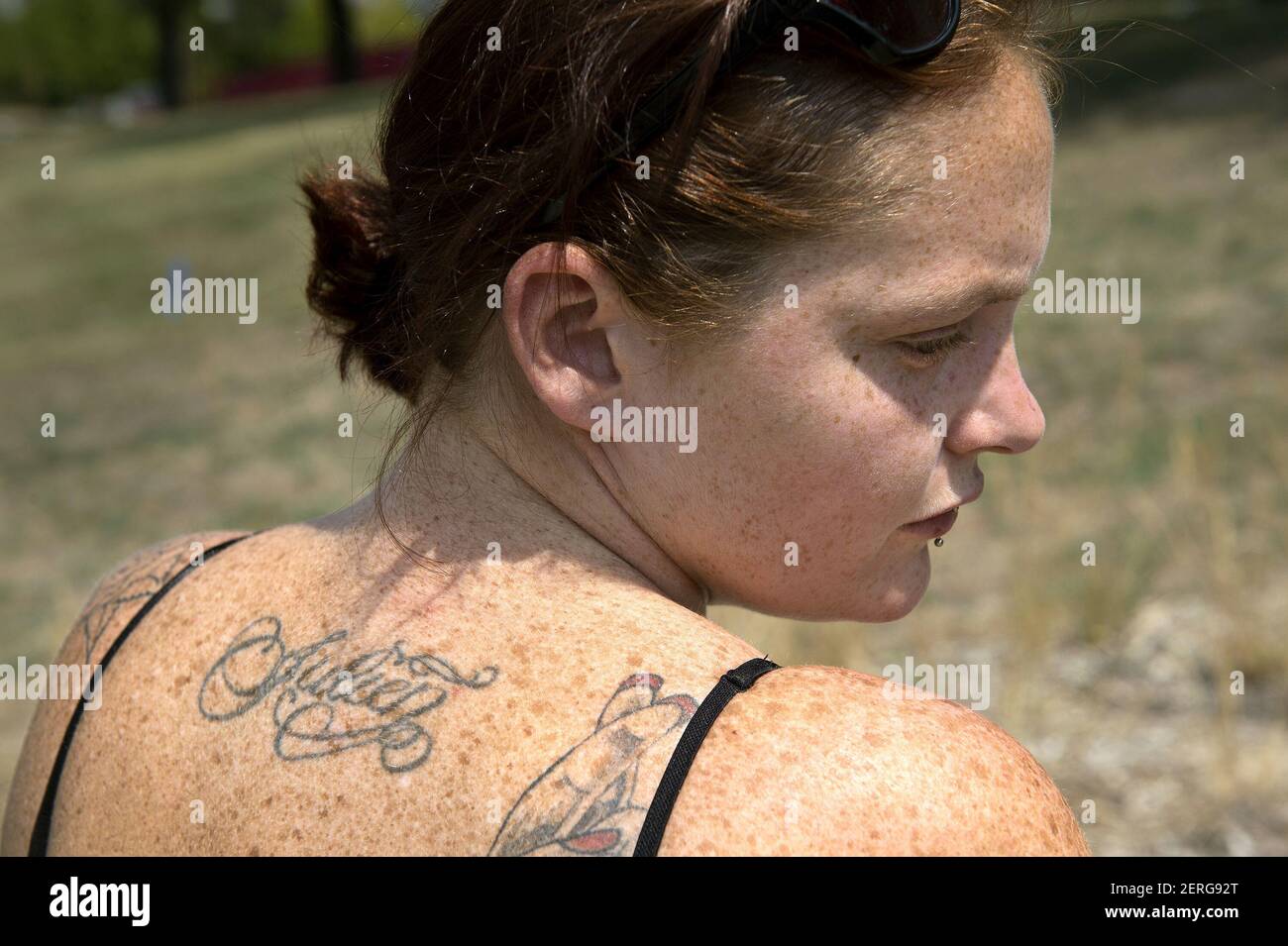 Ashley Lyons has her son's name, Julien, tattooed on her back. She was  outside Children's Mercy Hospital in Kansas City, Mo., on Friday, Aug. 10,  2018, where Julien (Sandlin) is recovering from, image size:1300x955