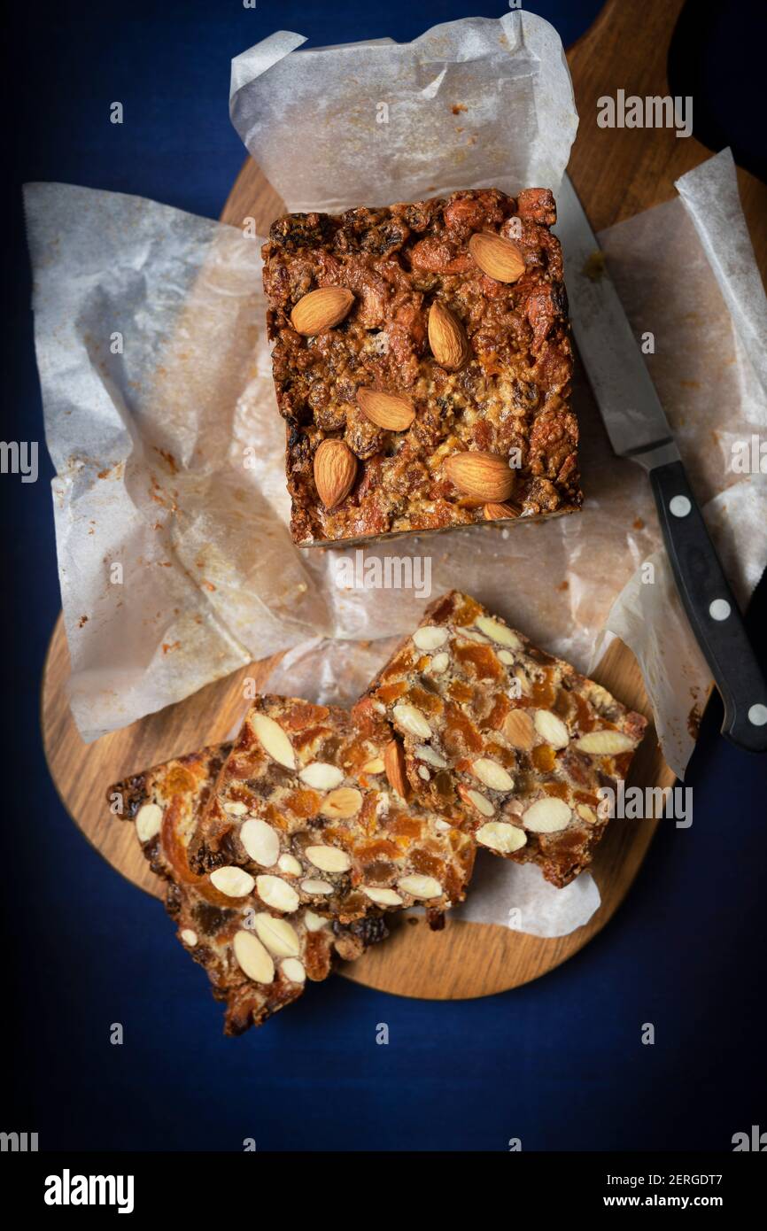 Dried fruit and nut cake cut in slices Stock Photo Alamy