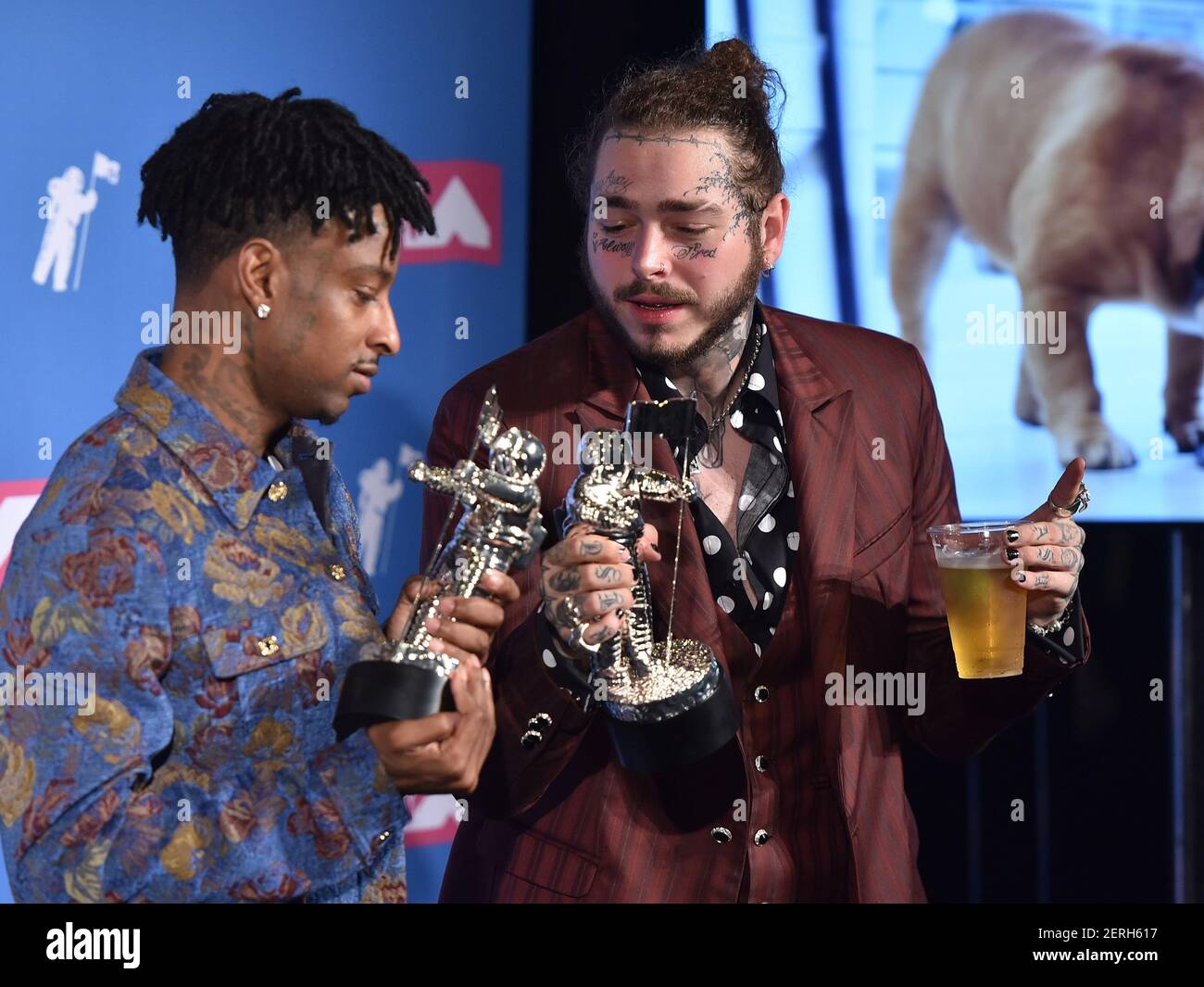 Recording artists 21 Savage (L) and Post Malone appear backstage after  winning the top Rap Song award for 'Rockstar,'' during the 2018 Billboard  Music Awards at MGM Grand Garden Arena on May