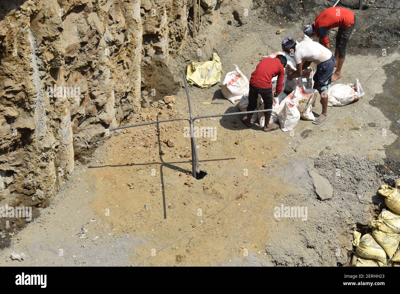 rock anchoring at construction site .workers installing rock anchor in