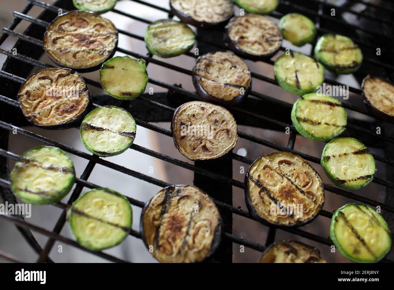 Cooking of eggplant and zucchini on the barbecue grill Stock Photo Alamy
