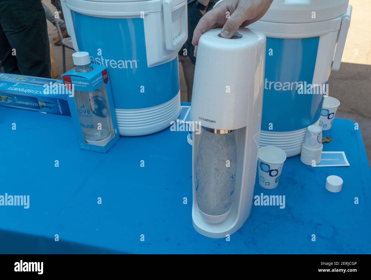 A Soda Stream worker demonstrates the carbonation method at the