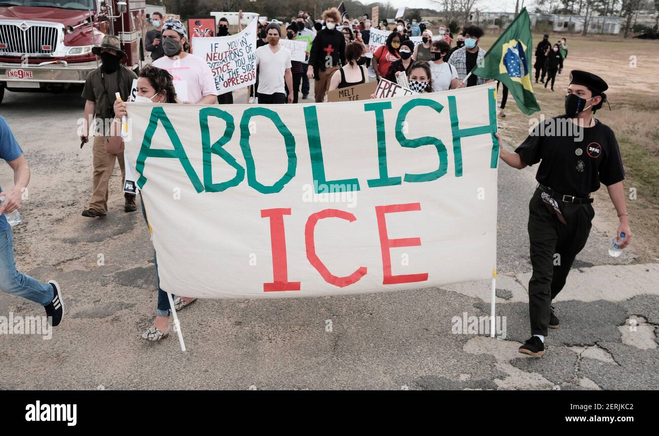 Ocilla, Georgia, USA. 28th Feb, 2021. Two demonstrators carry a sign that reads ABOLISH ICE while marching at the Irwin County Detention Center in Ocilla, GA Credit: John Arthur Brown/ZUMA Wire/Alamy Live News Stock Photo