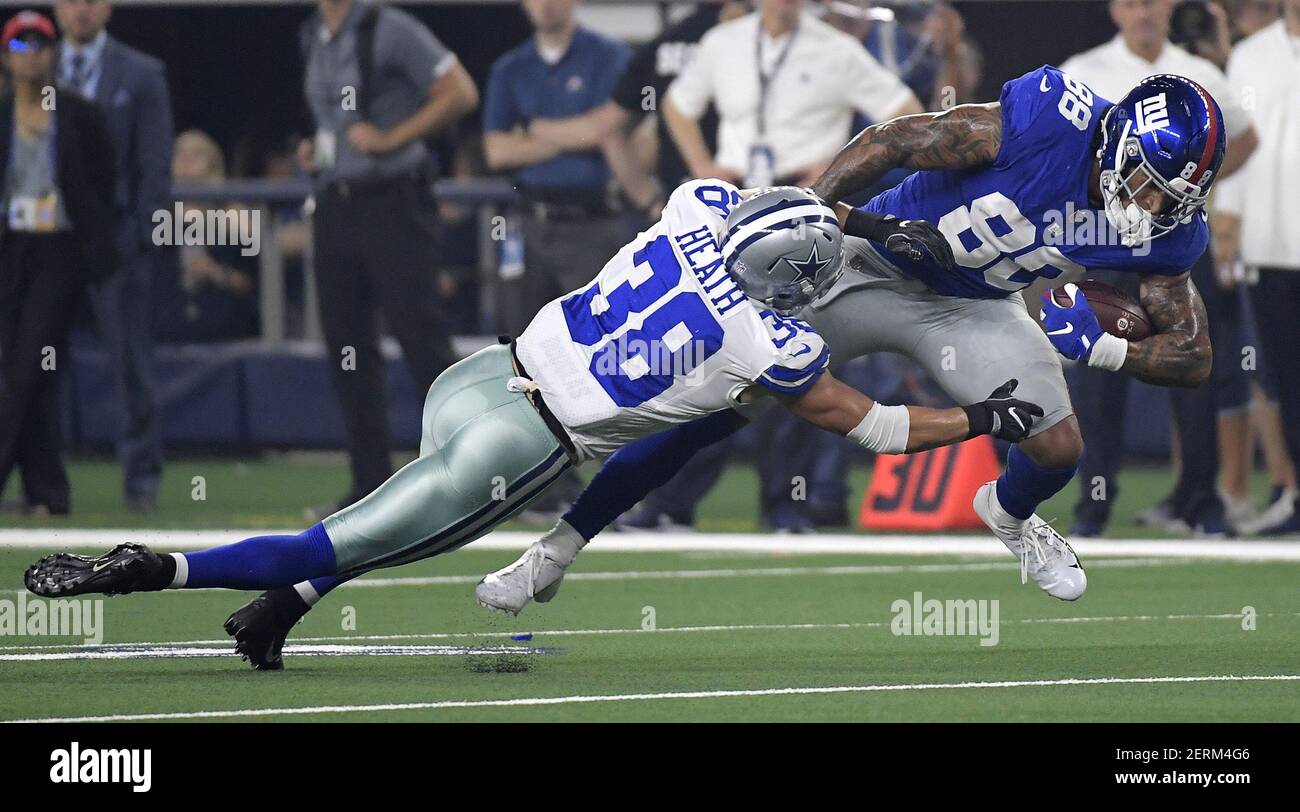 Dallas Cowboys defensive back Jeff Heath (38) stops New York Giants tight  end Evan Engram (88) during the second quarter on Sunday, Sept. 16, 2018 at  AT&T Stadium in Arlington, Texas. (Photo