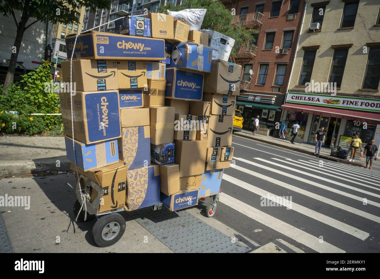 A deliveryman from Lasership with his cart laden with purchases from