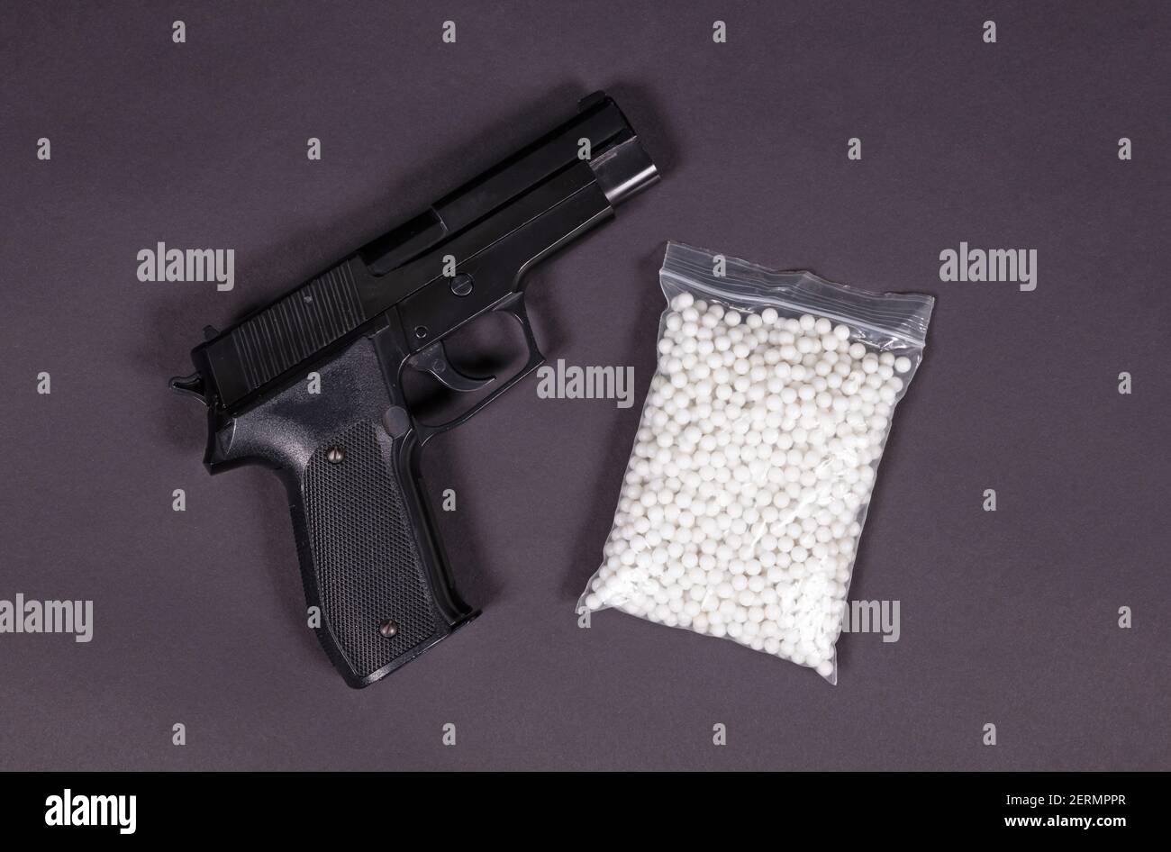 Airsoft pistol with bb bullets on dark background Stock Photo Alamy