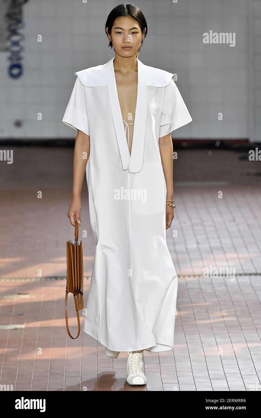 Model Chiharu Okunugi walks on the runway during the Jil Sander Fashion Show  during Milan Fashion
