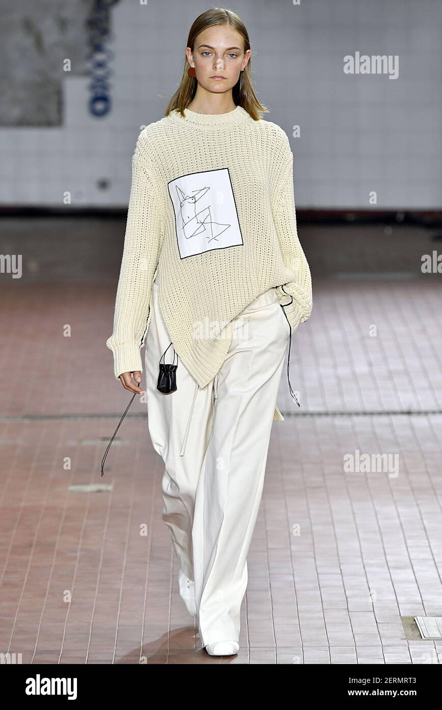 Model Nimue Smit walks on the runway during the Jil Sander Fashion Show  during Milan Fashion