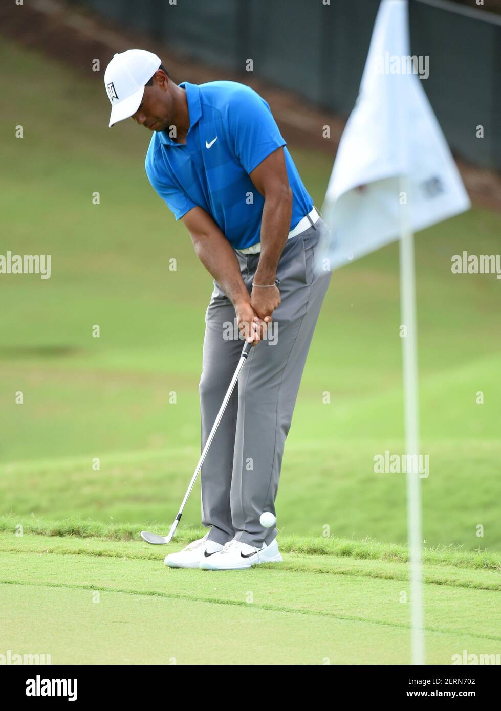 Sep 22, 2018; Atlanta, GA, USA; Tiger Woods chips on the 11th green during  the third round of the Tour Championship golf tournament at East Lake Golf  Club. Mandatory Credit: John David