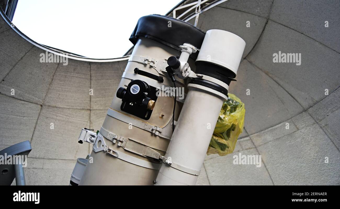 Powerful optical telescope under dome of an astronomic observatory