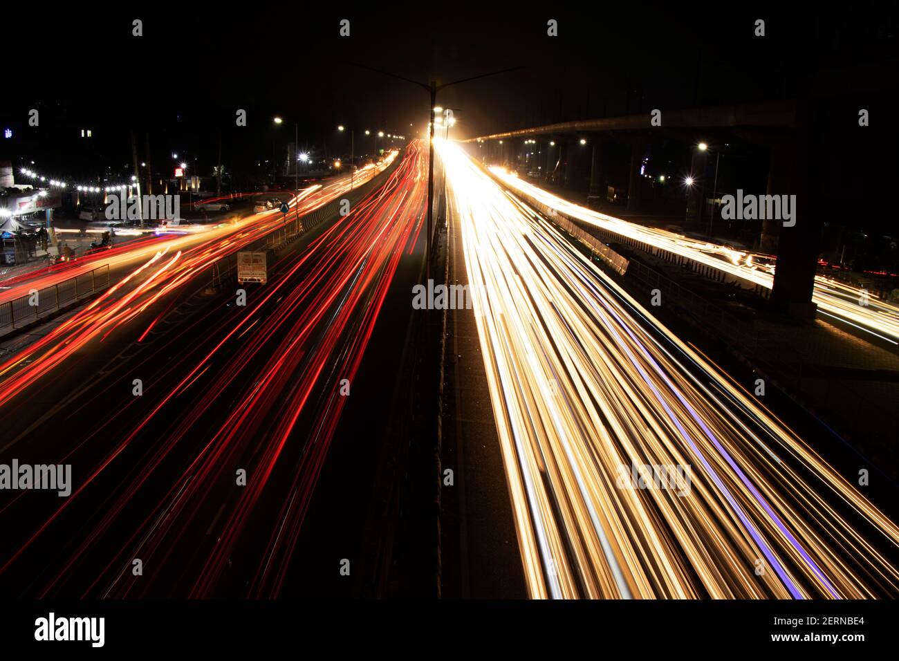 Speed Traffic light trails on highway, long exposure, urban background and dark sky Stock Photo