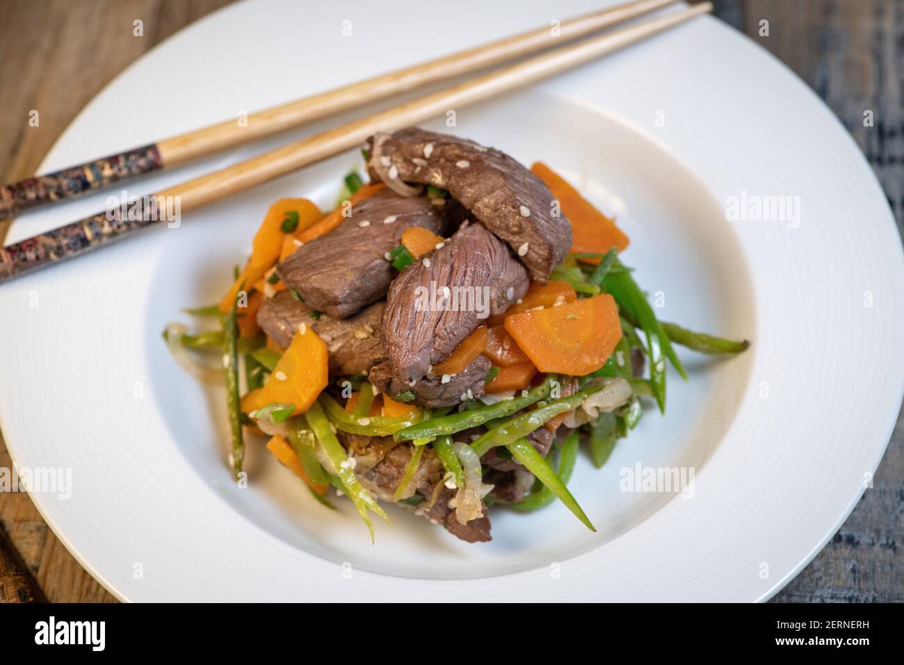 Recipe Sesame beef wok, minced summer vegetables Stock Photo