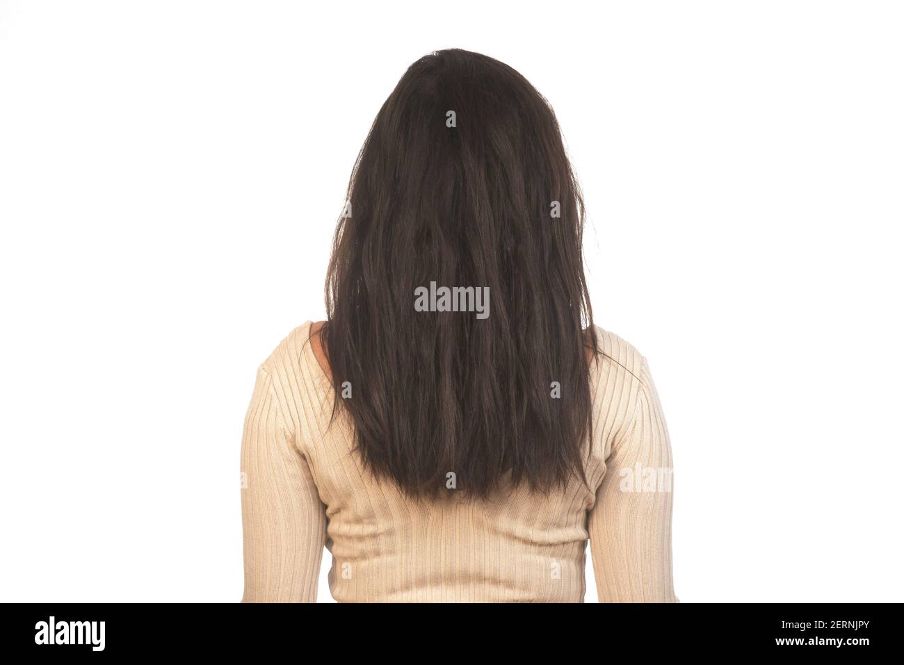 Rear view of woman with black hair against white background Stock Photo ...