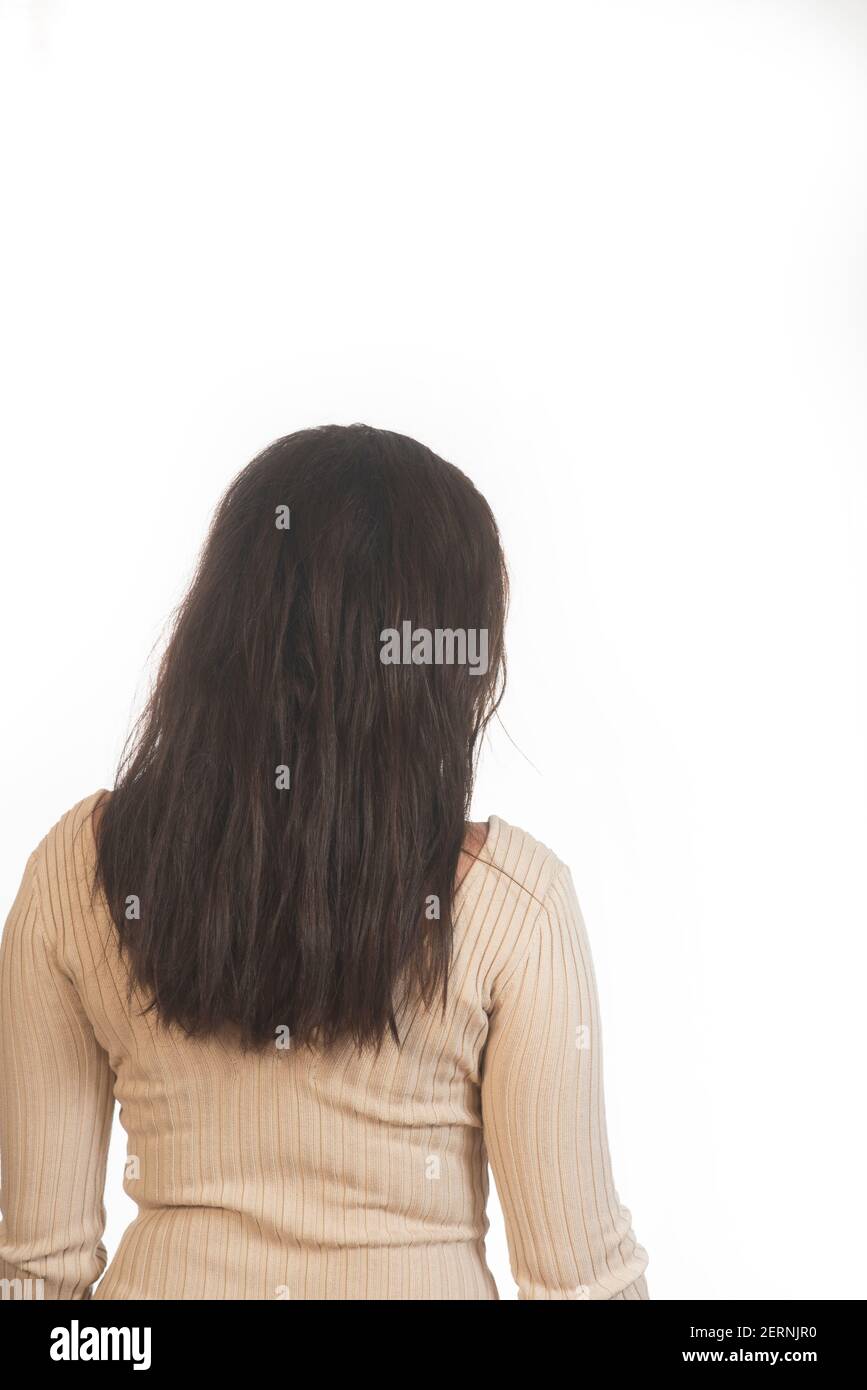 Rear view of woman with black hair against white background Stock Photo ...