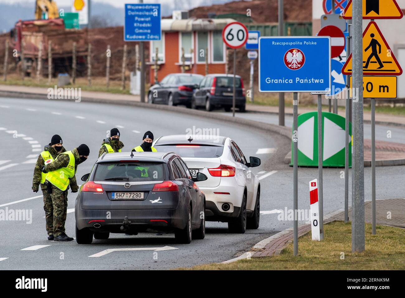 Nachod, Czech Republic. 27th Feb, 2021. Polish border guards inspect cars heading to Poland at the border in Nachod/Kudowa Zdroj in Czech Republic, on February 27, 2021. Passengers arriving in Poland from the Czech Republic and Slovakia will be quarantined from this day, unless they have a negative test or vaccination with two doses of covid-19 vaccine. Credit: David Tanecek/CTK Photo/Alamy Live News Stock Photo