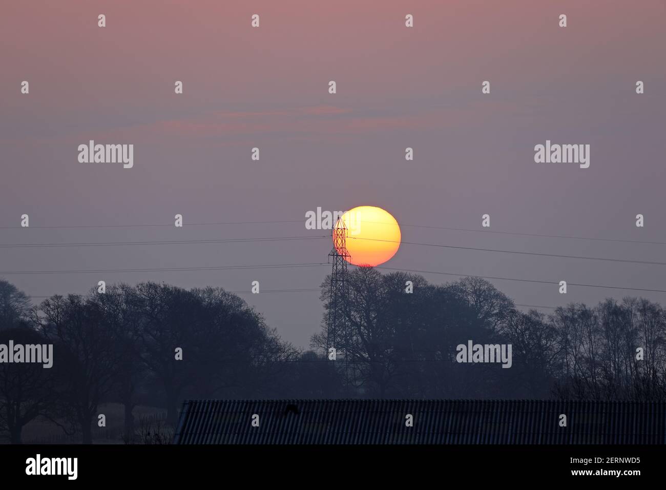 Teesdale, County Durham, UK. 1st March 2021. UK Weather.  The sun rises through fog and cloud on the first day of the Meteorological spring. The forecast is for the fog and cloud to clear to leave a bright afternoon for many. Credit: David Forster/Alamy Live News Stock Photo