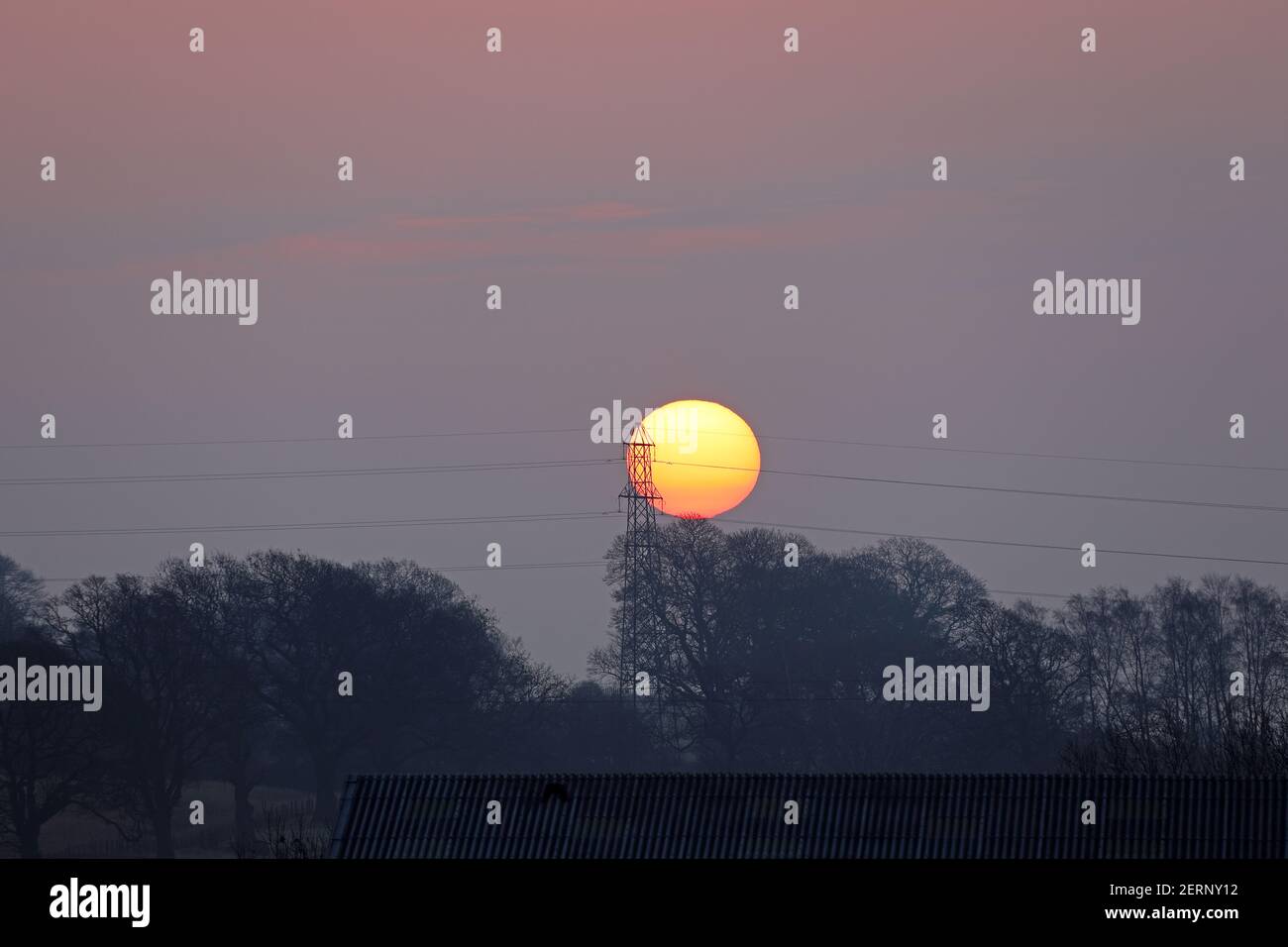 Teesdale, County Durham, UK. 1st March 2021. UK Weather.  The sun rises through fog and cloud on the first day of the Meteorological spring. The forecast is for the fog and cloud to clear to leave a bright afternoon for many. Credit: David Forster/Alamy Live News Stock Photo