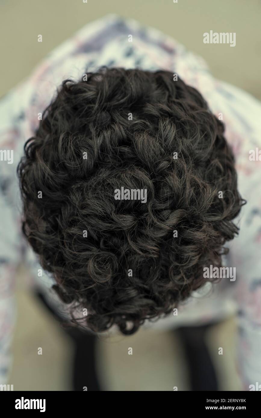 Short dark curly hair hi-res stock photography and images - Alamy