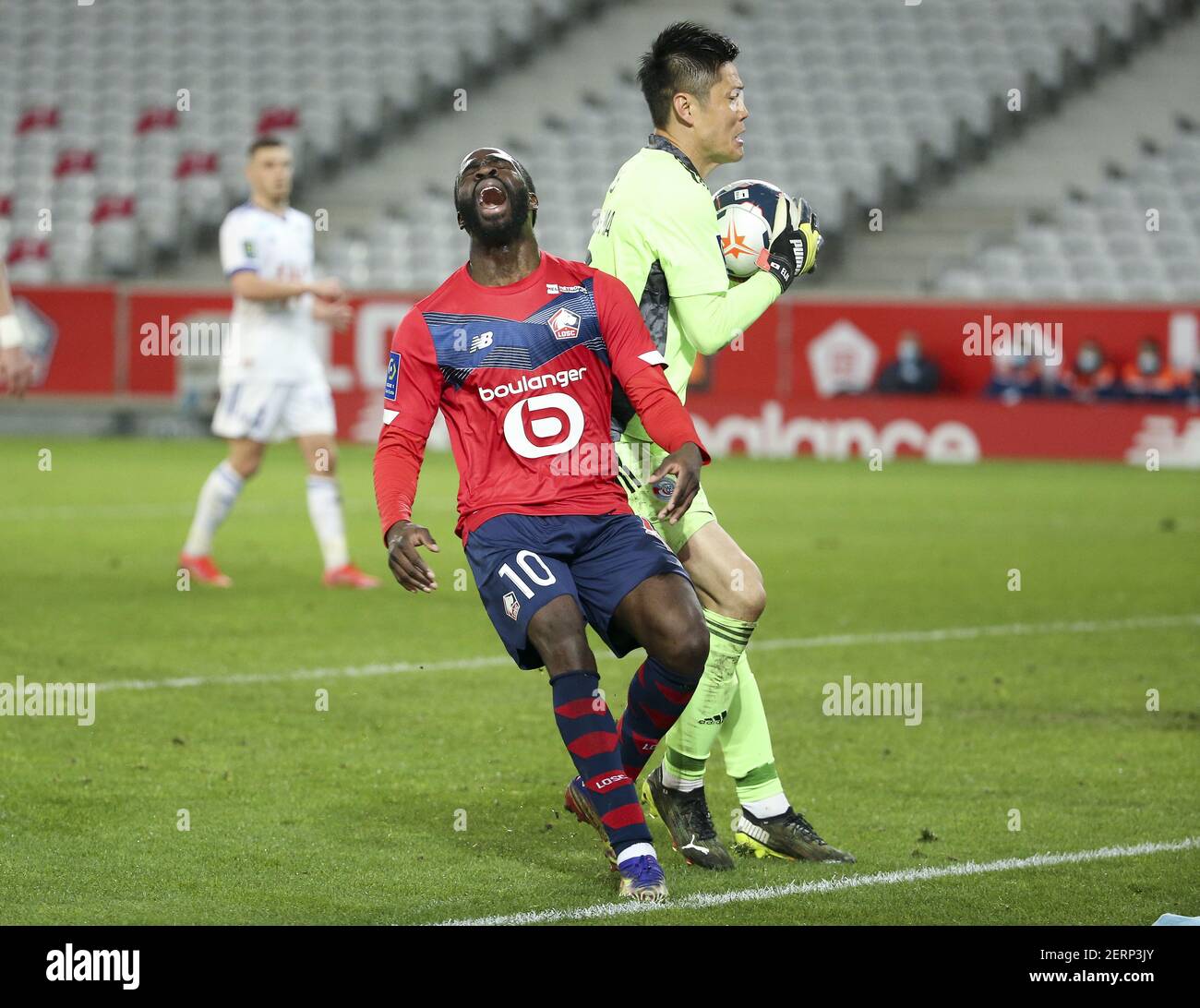 Jonathan Ikone of Lille frustrated, goalkeeper of Strasbourg Eiji Kawashima during the French championship Ligue 1 football match between Lille OSC and RC Strasbourg on february 28, 2021 at Pierre Mauroy stadium in Villeneuve-d'Ascq near Lille, France - Photo Jean Catuffe / DPPI / LiveMedia Stock Photo