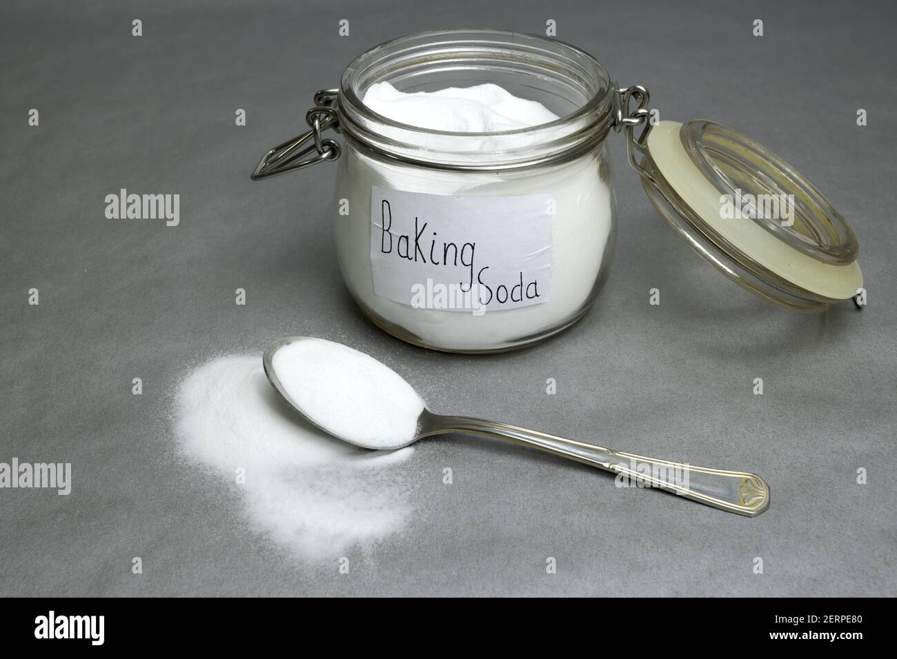 Baking soda isolated on gray background Stock Photo