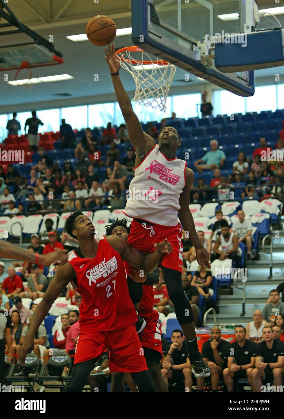 Miami Heat forward Bam Adebayo (13) goes to the basket against center  Hassan Whiteside (21) during the first quarter of the HEAT Red, White &  Pink scrimmage at FAU Arena in Boca