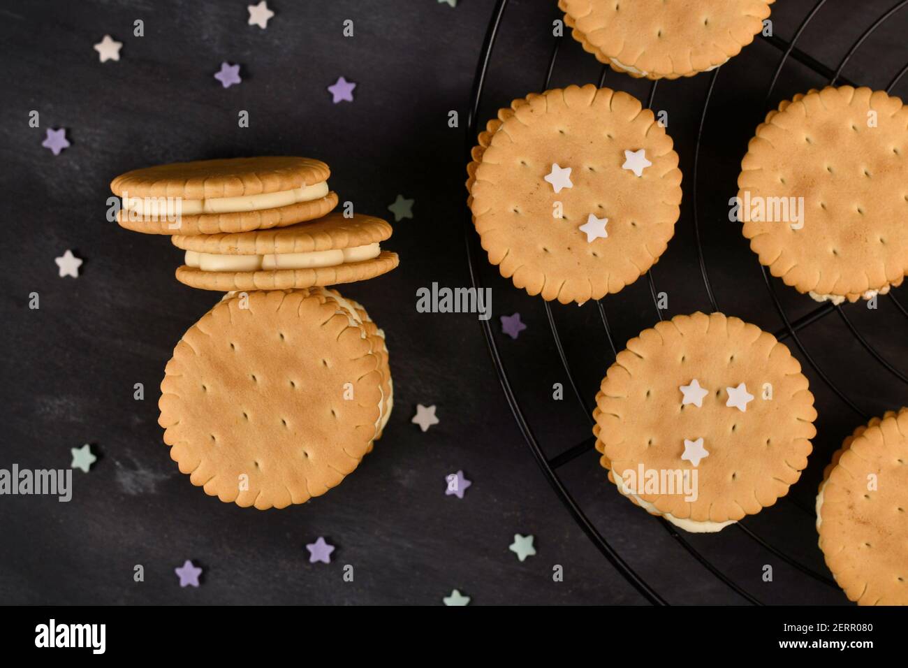 Cream filled sandwich cookies on dark background Stock Photo