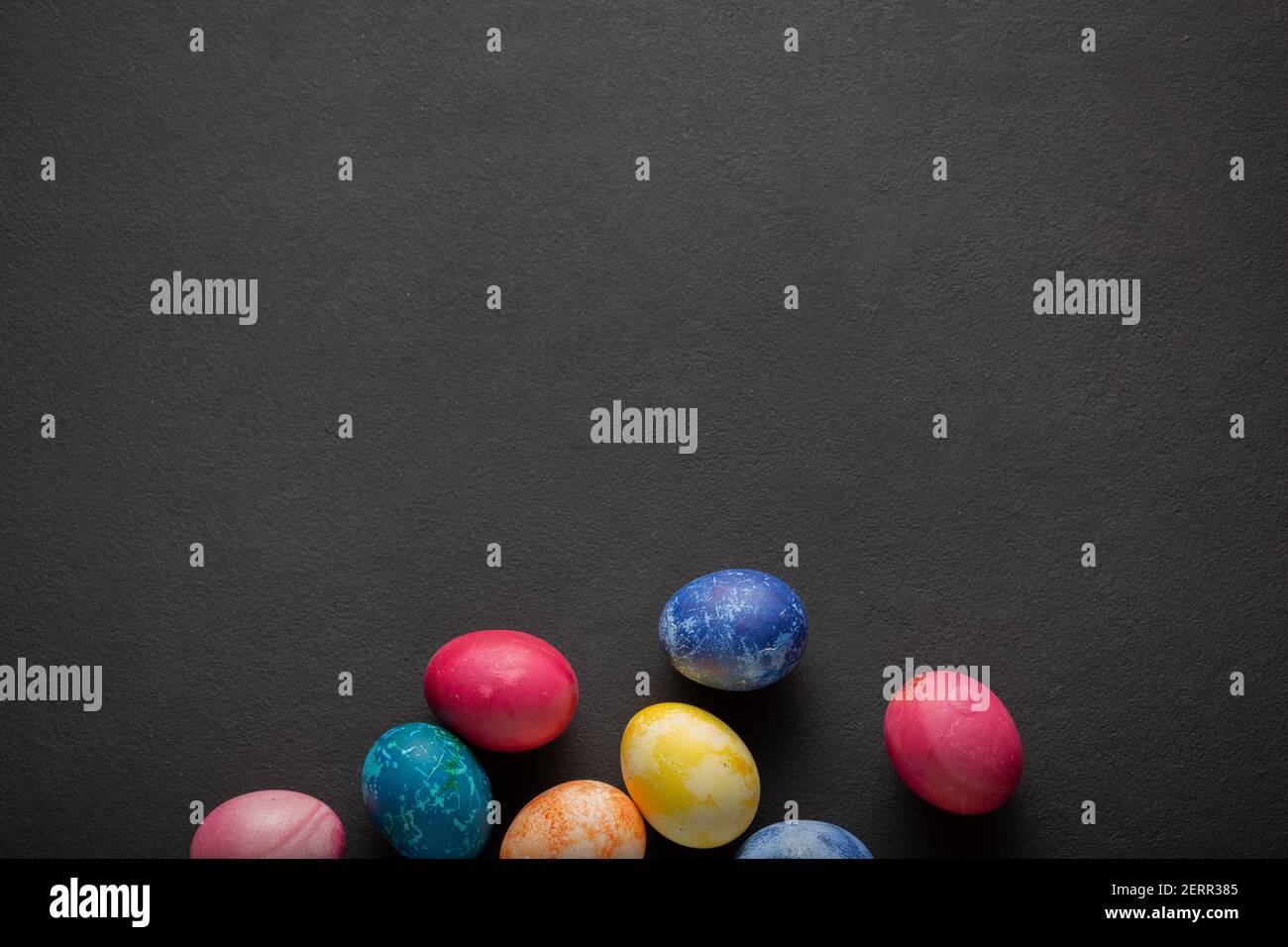 Easter eggs against dark background with copy space Stock Photo