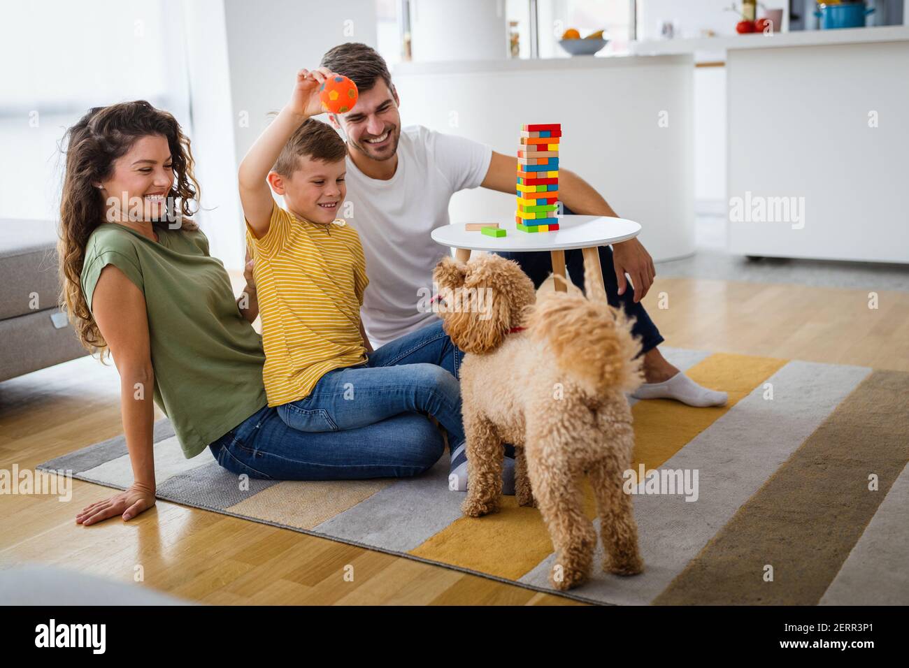 Happy family with parents and son playing and having fun at home Stock ...