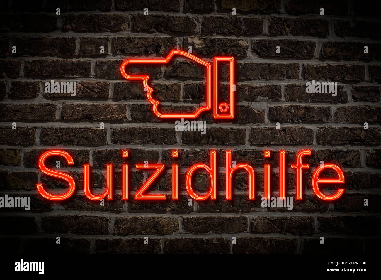 Detail photo of a neon sign on a wall with the inscription Suizidhilfe (medically assisted suicide) Stock Photo