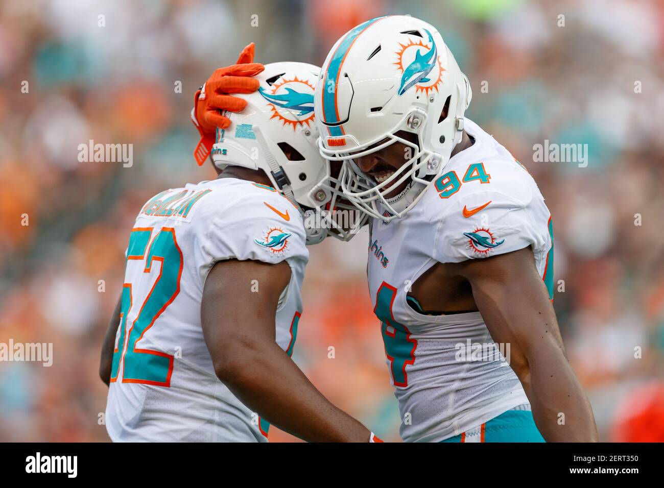 Miami, United States. 25th Dec, 2022. Miami. FL USA; Miami Dolphins safety  Elijah Campbell (22) and defensive tackle Raekwon Davis (98) celebrate  after tackling Green Bay Packers cornerback Keisean Nixon (25) during