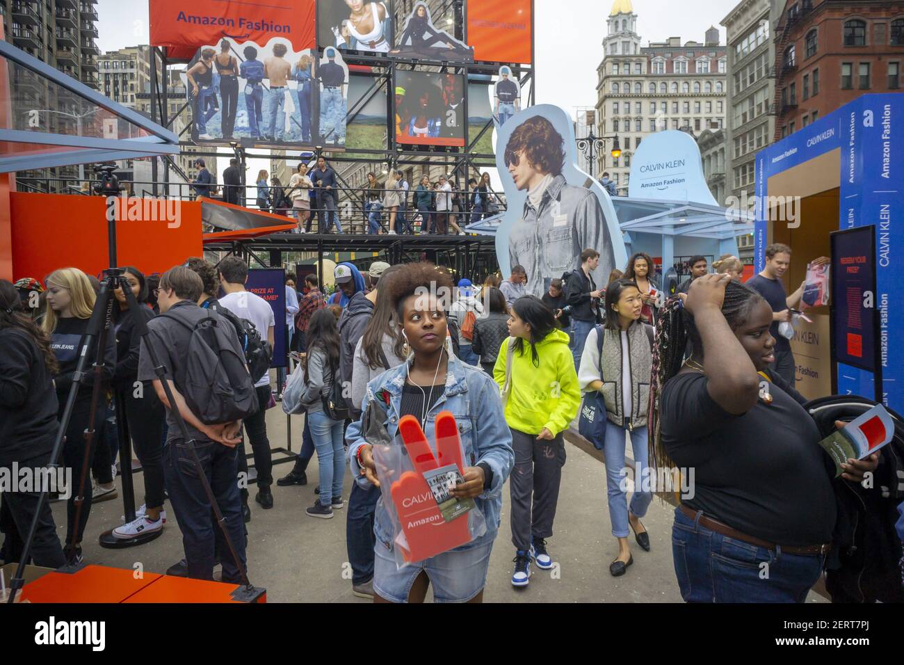 Hundreds of visitors flock to the Calvin Klein X Amazon Fashion  collaboration branding event in Flatiron Plaza in New York on Saturday,  October 6, 2018. Visitors were treated to a number of "experiences"  including games, product drops and a popcorn selfie ...