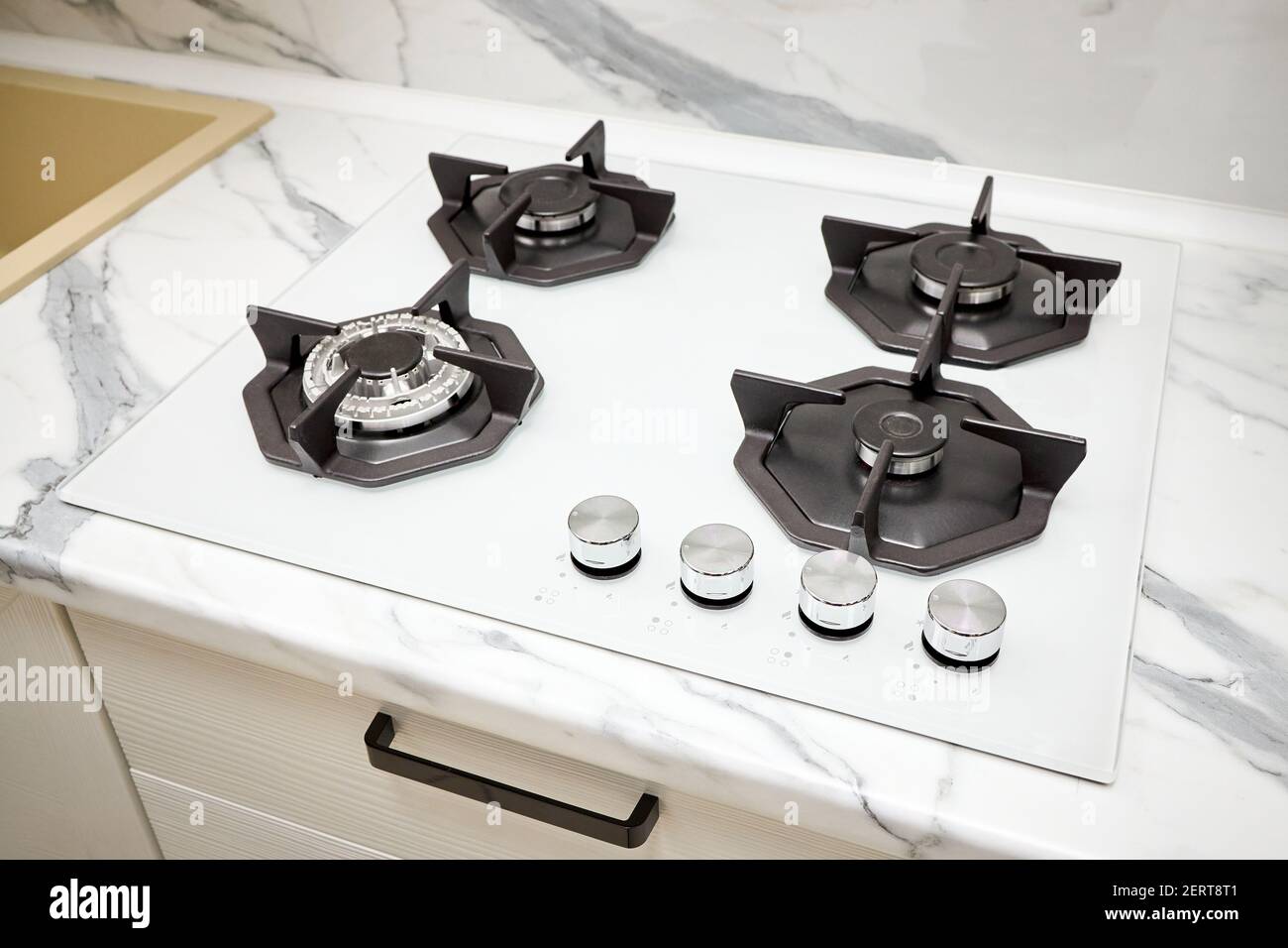 Modern gas stove on counter top white closeup. Hob gas stove using natural  gas or propane for cooking products on light countertop for cooking Stock  Photo - Alamy