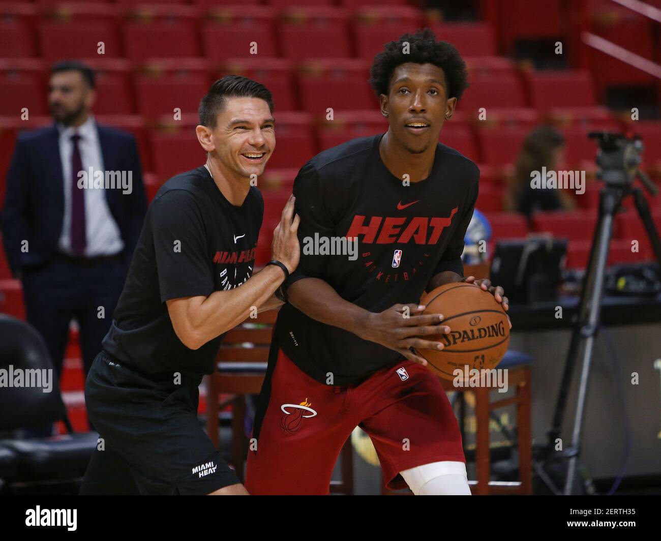 Miami Heat guard Josh Richardson, right, works with Heat assistant coach  Chris Quinn before the start of a preseason game against the New Orleans  Pelicans at AmericanAirlines Arena in Miami on Wednesday,
