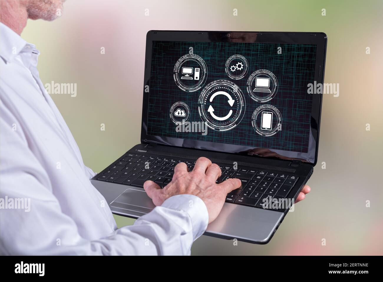 Man using a laptop with system update concept on the screen Stock Photo