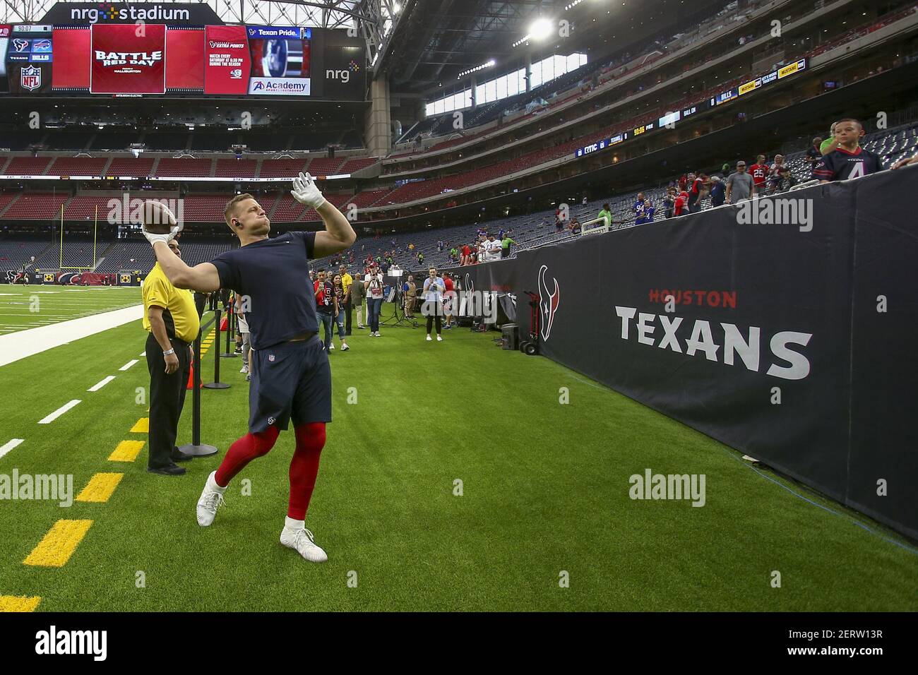 October 14, 2018: Houston Texans defensive end J.J. Watt (99) throws the ball in the stands with fans before the start of their game against the Buffalo Bills at NRG Stadium in Houston, TX. John Glaser/CSM/Sipa USA.(Credit Image: &copy; John Glaser/CSM/Sipa USA) Stock Photo