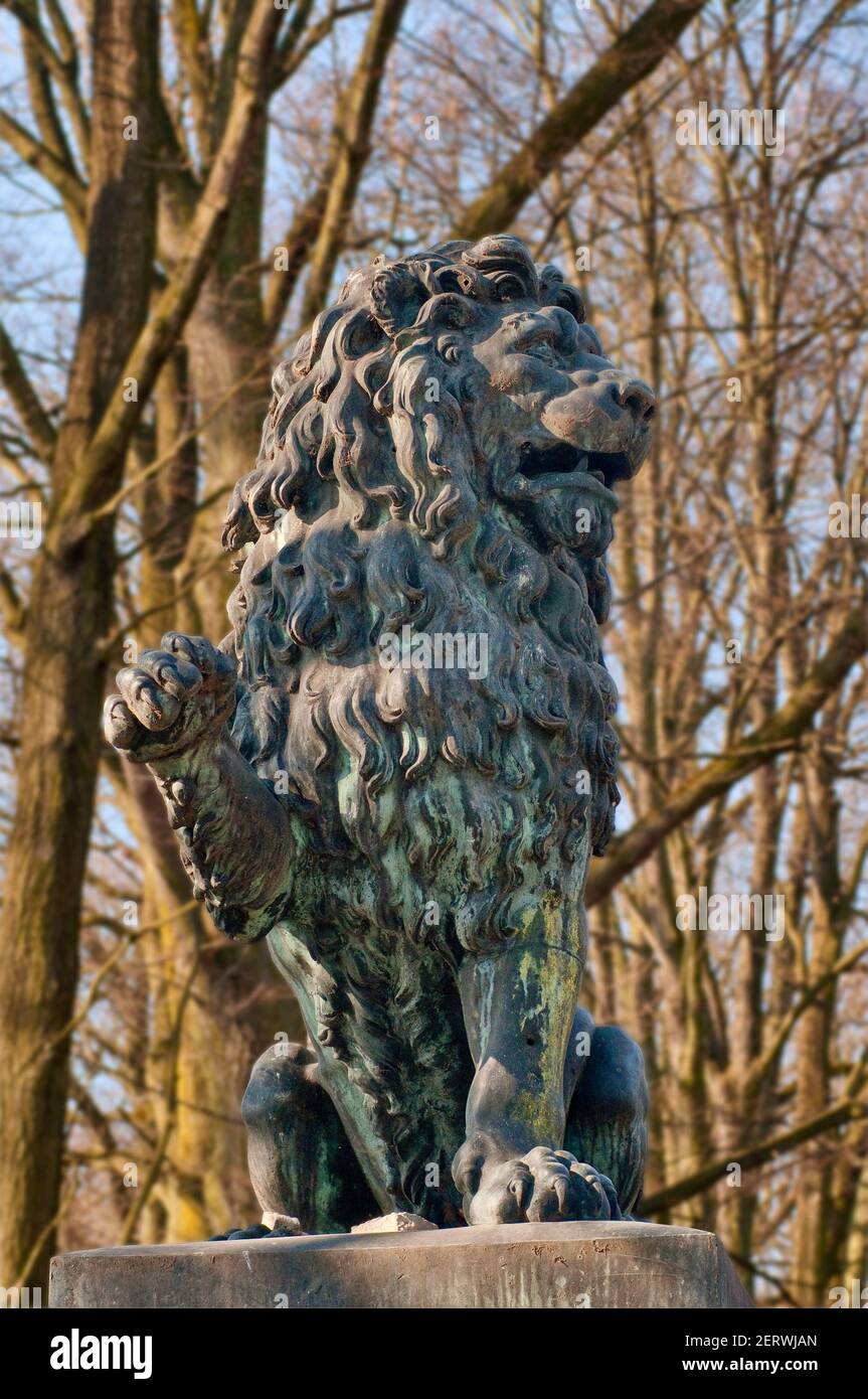 Sculpture of lion at gate to castle in Moszna, Upper Silesia region, Opolskie, Poland Stock Photo