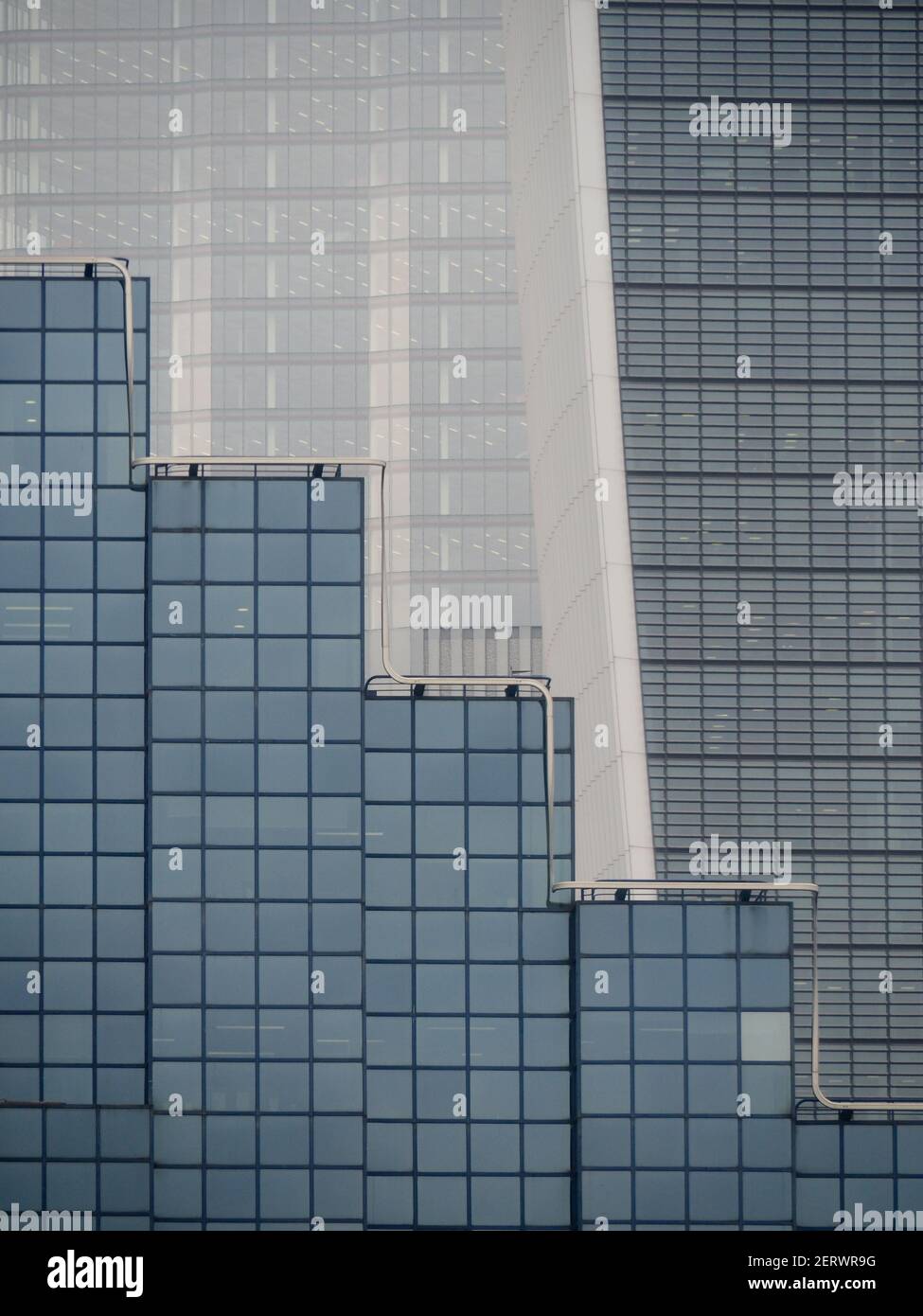 semi-abstract telephoto close-up of patterns of modern glass buildings  Stock Photo