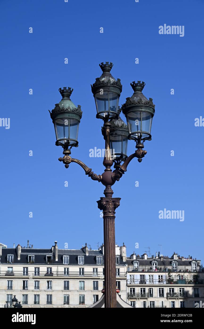 Vintage street lamp with an Hausmann building in the background Stock Photo