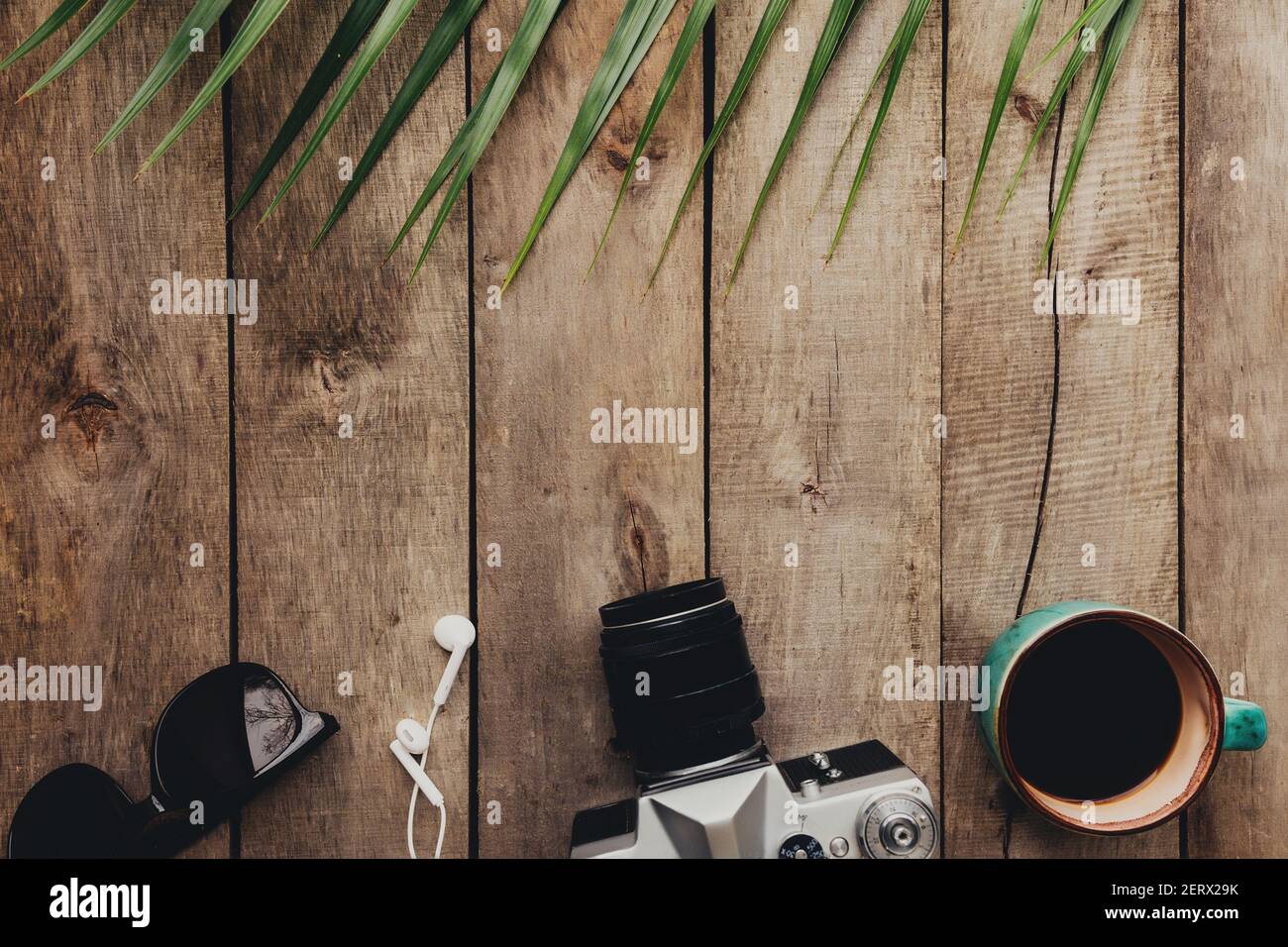 Flat lay travel concept photo camera cup of coffee eyeglasses