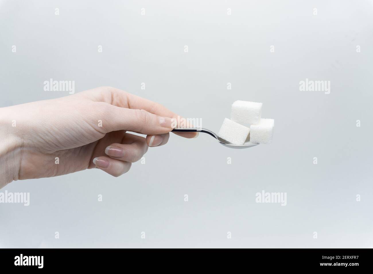 sugar cubes per teaspoon calories sweets ingredient Stock Photo Alamy