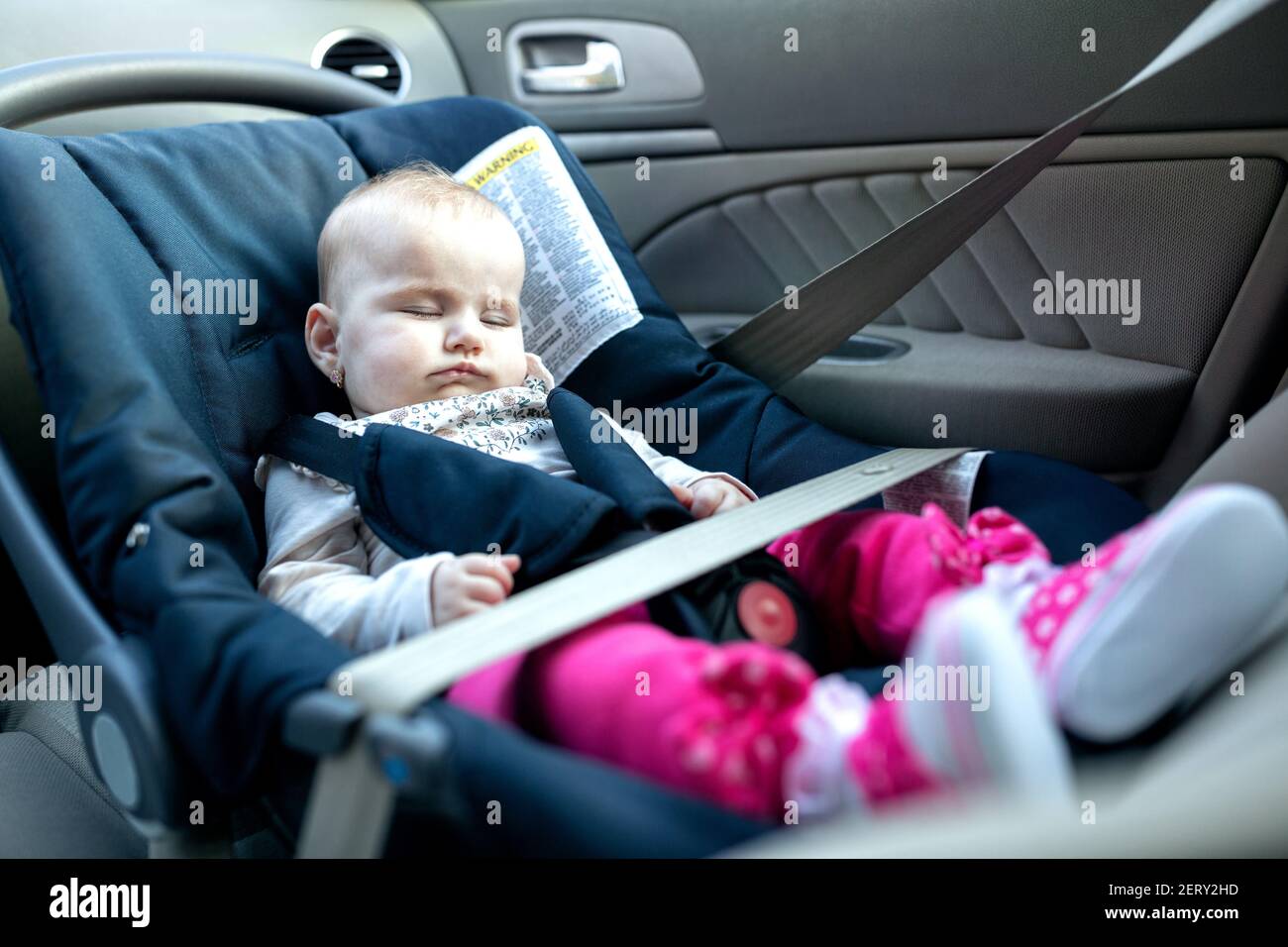 Baby taking a nap with baby car seat providing the comfort during the