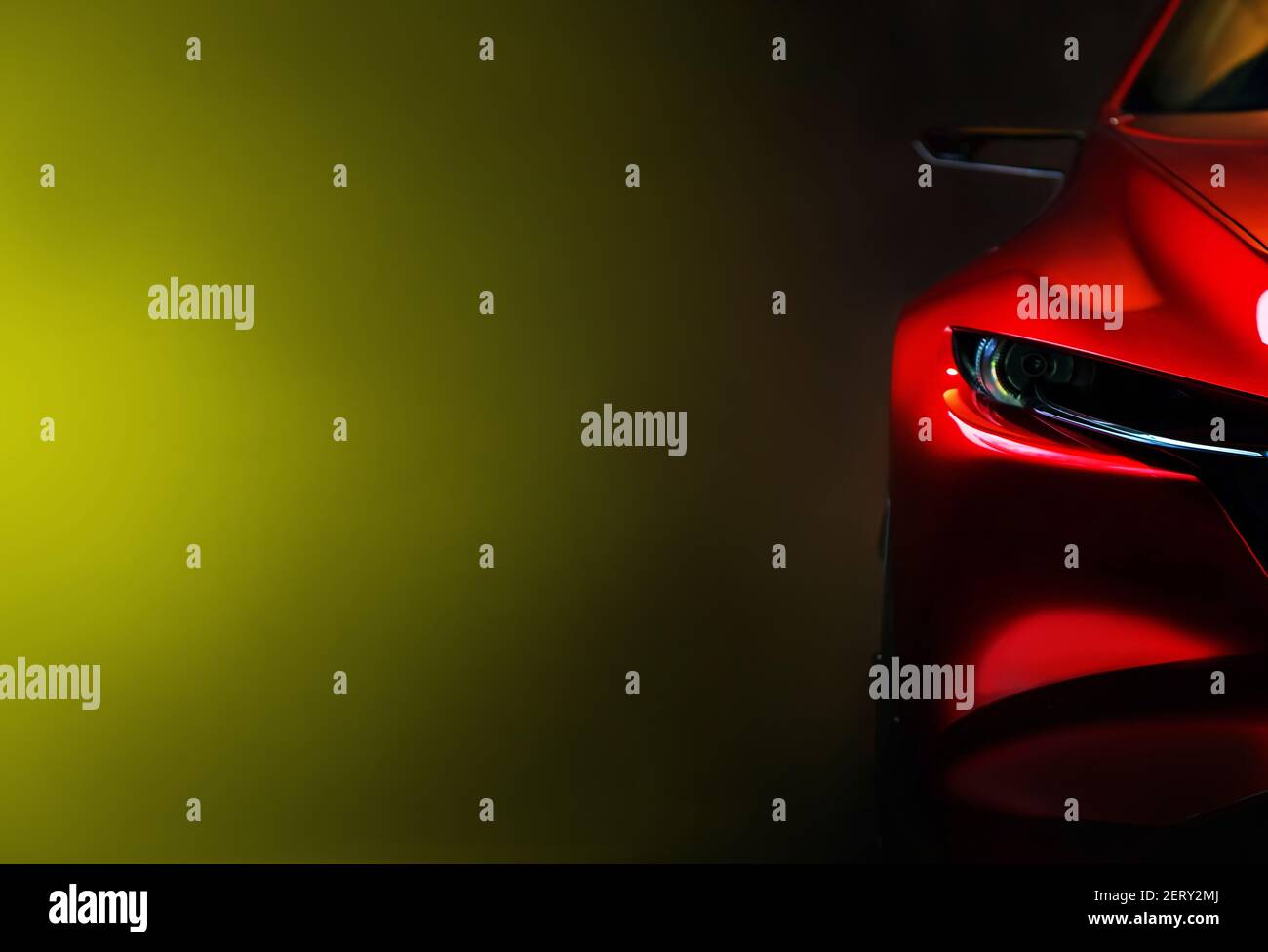 Red modern car headlights on black background, copy space Stock Photo