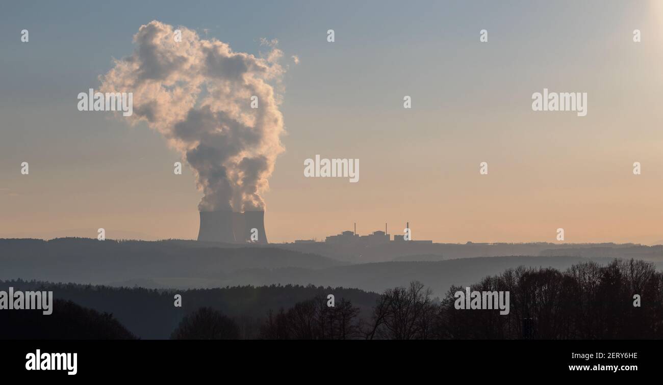 Temelin, Czech republic - 02 28 2021: Nuclear Power Plant Temelin, Steaming cooling towers in the landscape on the horizon at sunset Stock Photo