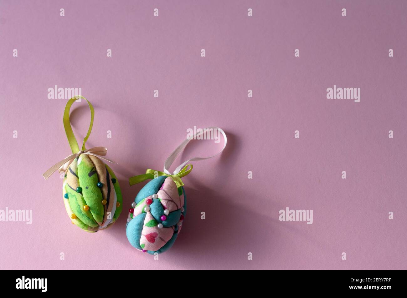 Easter eggs made of styrofoam, decorated with colorful fabric, copy space for text Stock Photo
