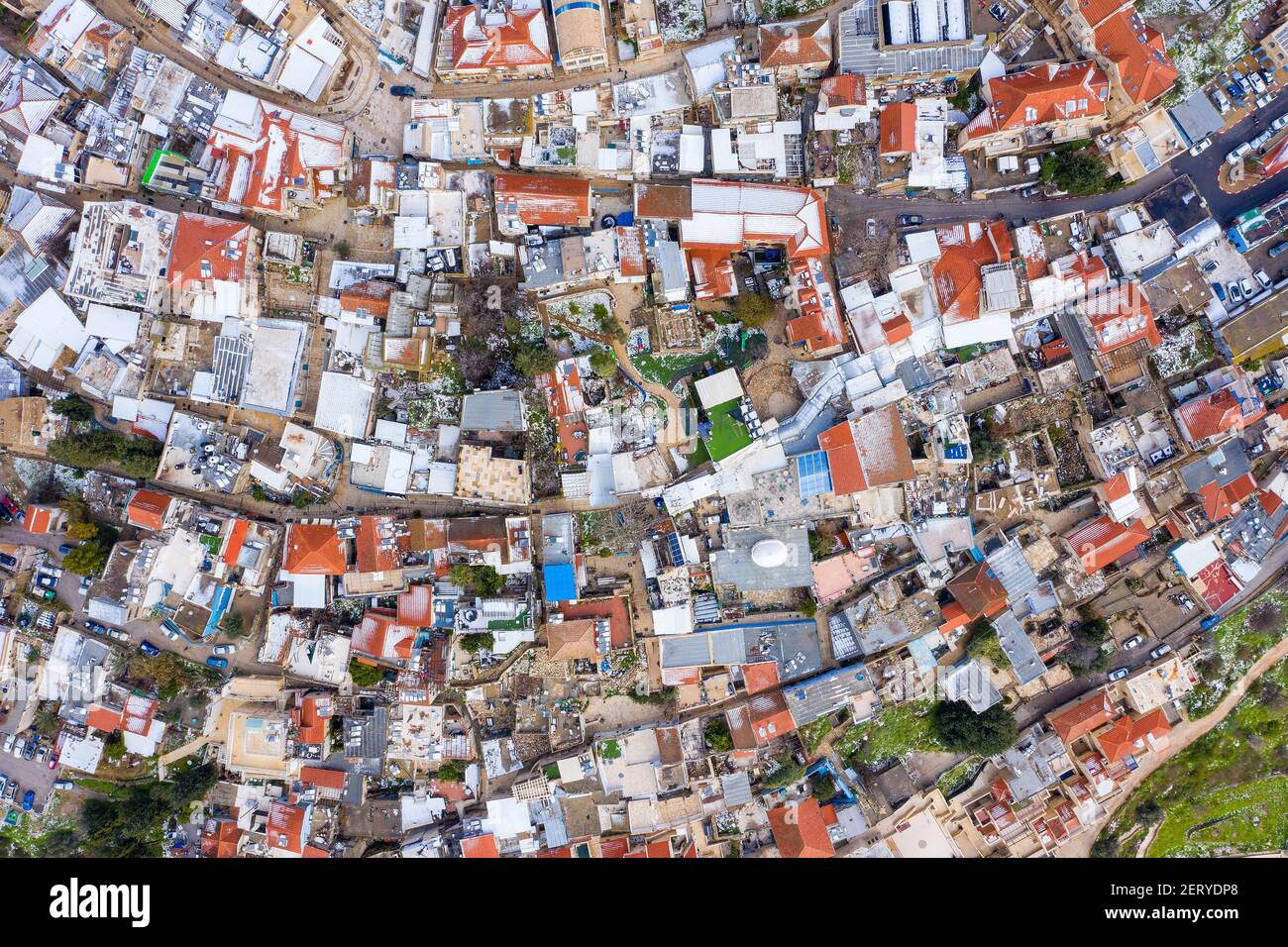 Safed old Jewish quarter houses, with light snow covering rooftops, Aerial view. Stock Photo