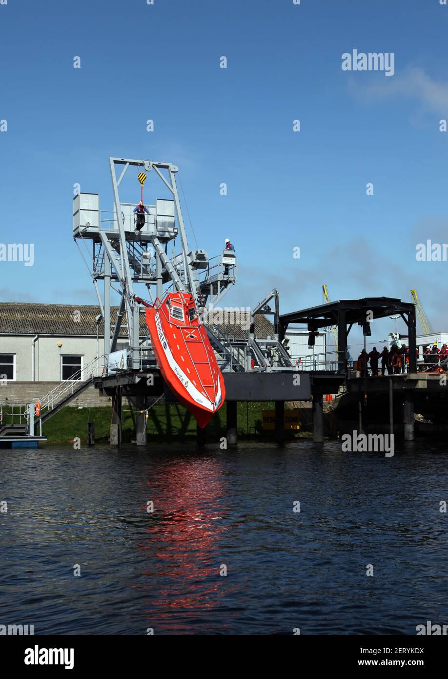 Sequence of a Free Fall Lifeboat being released and dropped Stock Photo