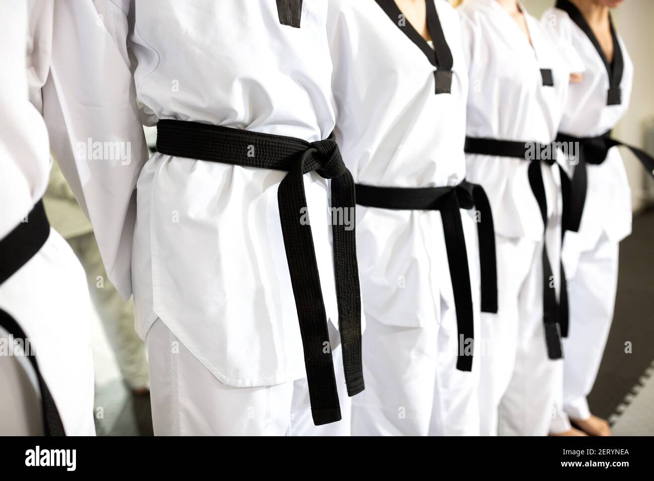 Close up of martial art uniforms with belts, concept of high discipline